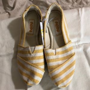 Yellow and cream shoes